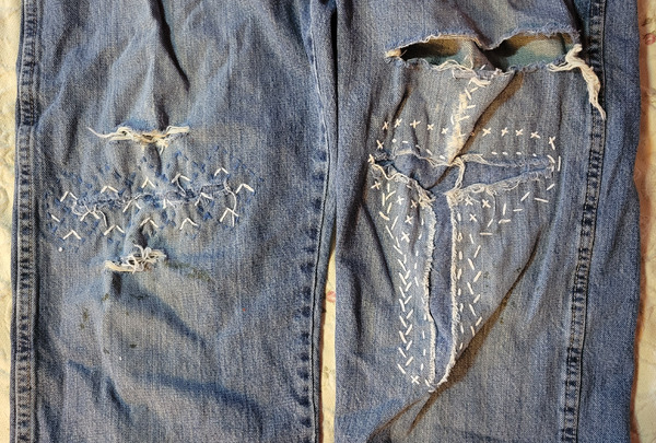 Blue jean knees repaired with sashiko