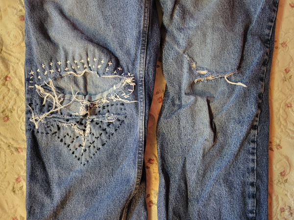Blue jean knees repaired with sashiko