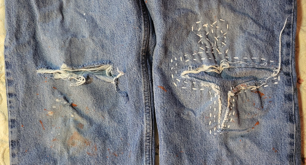 Blue jean knees repaired with sashiko
