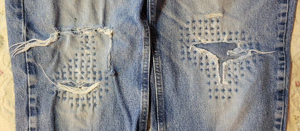 Blue jean knees repaired with sashiko